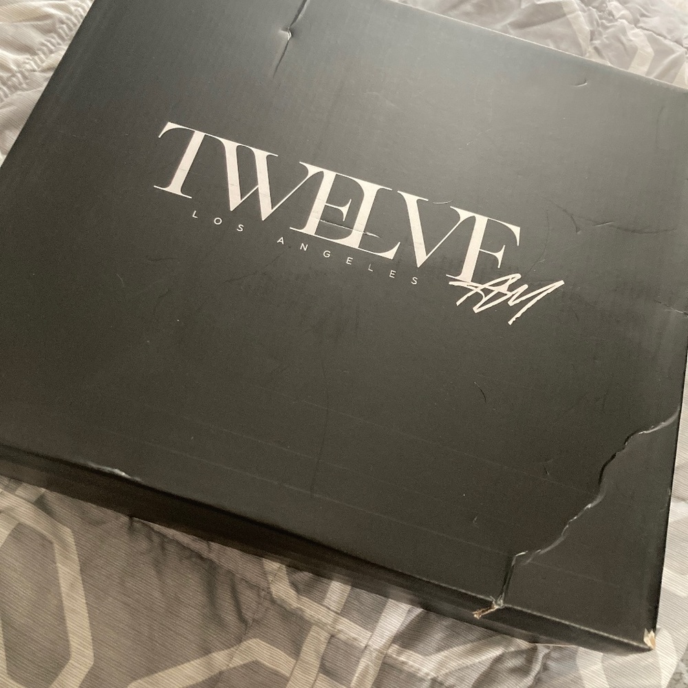 Snake print knee high boots